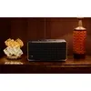 JBL Authentics 500 smart home speaker in Black, on a wooden sideboard