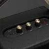 Marshall Tufton portable Bluetooth speaker in Black and Brass, close-up of the brass control knobs and battery indicator