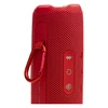 JBL Flip 7 portable Bluetooth speaker in Red, carabiner on the PushLock mount beside the Bluetooth, power and Auracast buttons