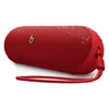 Beats Pill portable Bluetooth speaker in Statement Red, angled view with the lanyard attached and water drops