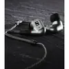 Sennheiser IE 200 wired in-ear monitors, Silver Edition, on a dark wooden surface