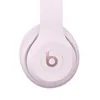 Beats Solo 4 on-ear wireless headphones in Cloud Pink, ear cup close-up with the b logo