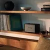 Marshall Acton III Bluetooth home speaker in Black, on a living room shelf