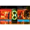 JBL PartyBox 720 portable Bluetooth party speaker in Black, beside a pool at a night party