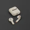 Marshall Minor IV true wireless earbuds in Cream, charging case and both earbuds from above