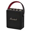 Marshall Stockwell III portable Bluetooth speaker in Black and Brass, angled front view with the carry strap