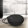 boAt Stone 193 portable Bluetooth speaker in Black, on a desk with its lanyard