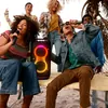 JBL PartyBox Wireless Mic digital wireless microphones in Black, friends singing together at a beach party