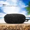 boAt Stone 193 portable Bluetooth speaker in Black, on a wooden table with water drops, IPX7 rated