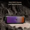 boAt Stone 580 portable Bluetooth speaker in Midnight Black, on rocks with its carry strap, 12W stereo sound