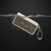 Marshall Middleton portable Bluetooth speaker in Cream, held under water