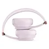 Beats Solo 4 on-ear wireless headphones in Cloud Pink, folded with the ear cups stacked