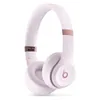 Beats Solo 4 on-ear wireless headphones in Cloud Pink, angled front view