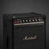 Marshall Bromley 450 portable Bluetooth party speaker in Black and Brass, angled view with water drops on the cabinet