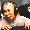 JBL Quantum 250 wired gaming headset in Black, worn while gaming at a PC