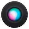 Apple HomePod mini smart speaker in Midnight, top view of the backlit touch surface