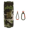 JBL Flip 7 portable Bluetooth speaker in Squad, with the finger loop and carabiner