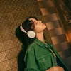 Sennheiser Accentum Plus Wireless noise cancelling headphones in White, worn by a woman in a green jacket