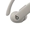 Beats Powerbeats Pro 2 true wireless earbuds in Quick Sand, close-up of the ear hook and b button