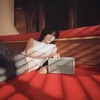 Marshall Acton III Bluetooth home speaker in Cream, on a bed