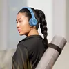 Beats Solo 4 on-ear wireless headphones in Slate Blue, worn
