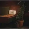 Marshall Acton II Bluetooth home speaker in White, on a side table in a living room