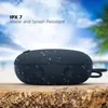 boAt Stone 193 portable Bluetooth speaker in Blue, on a wooden table with water drops, IPX7 rated