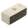 Marshall Emberton II portable Bluetooth speaker in Cream, angled top view with water droplets
