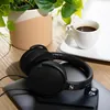 Sennheiser HD 400U USB-C wired over-ear headphones in Black, plugged into a phone on a desk