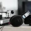 Sennheiser HD 600 open-back audiophile headphones in Black, beside a turntable