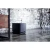 Bose Bass Module 500 wireless subwoofer in Black, on the floor of a living room