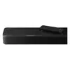 Bose Smart Ultra Soundbar with Dolby Atmos in Black, close-up of one end with the included remote on the glass top