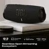 JBL Charge 5 Wi-Fi portable Bluetooth speaker in Black, on a living room shelf