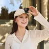 DJI Osmo Nano Standard Combo 4K Wearable Camera, 128GB, worn on a cap with the Magnetic Hat Clip