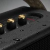 Marshall Kilburn II portable Bluetooth speaker in Black and Brass, water droplets on the top panel
