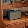 Marshall Acton III Bluetooth home speaker in Midnight Blue, on a bookshelf