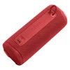 JBL Grip portable Bluetooth speaker in Red, lying on its side, back panel with USB-C port