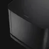 Bose Bass Module 500 wireless subwoofer in Black, close-up of the top edge and Bose logo