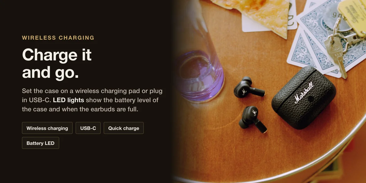 Marshall Motif II A.N.C. earbuds and case on a table: wireless charging, USB-C, quick charge and battery LED