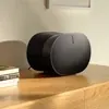 Sonos Era 300 Dolby Atmos speaker in Black, on a wooden sideboard