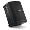 Bose S1 Pro+ portable PA system in Black, tilted back on the floor