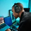 Sennheiser HD 650 open-back audiophile headphones in Black, worn at a laptop and mixing desk