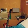 Marshall Acton III Bluetooth home speaker in Brown, on a bedroom shelf