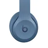 Beats Solo 4 on-ear wireless headphones in Slate Blue, ear cup close-up with the b logo
