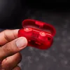 Beats Solo Buds true wireless earbuds in Transparent Red, earbuds in the open case in hand