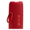 JBL Flip 7 portable Bluetooth speaker in Red, carabiner on the PushLock mount beside the Bluetooth, power and Auracast buttons