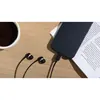 Sennheiser CX 80U USB-C wired earphones in Black, plugged into a phone on a desk