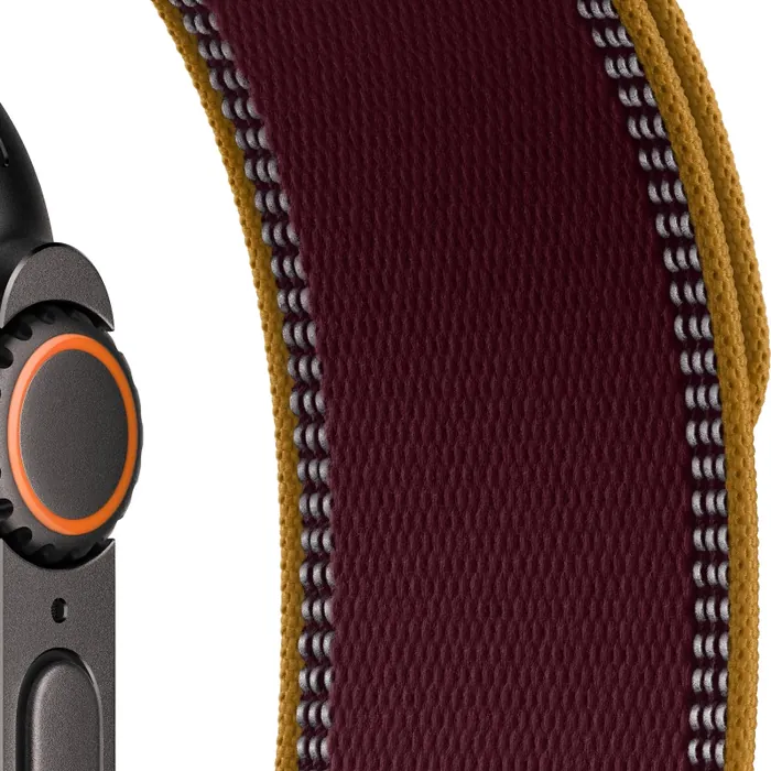 Apple Watch Ultra 4 in Black Titanium with the Burgundy Trail Loop, close-up of the Digital Crown, side button and strap with its reflective edges