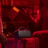 Bose SoundLink Max portable Bluetooth speaker in Black, on a crate at a party