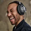 Sennheiser HD 820 closed-back audiophile headphones in Black, worn by a listener